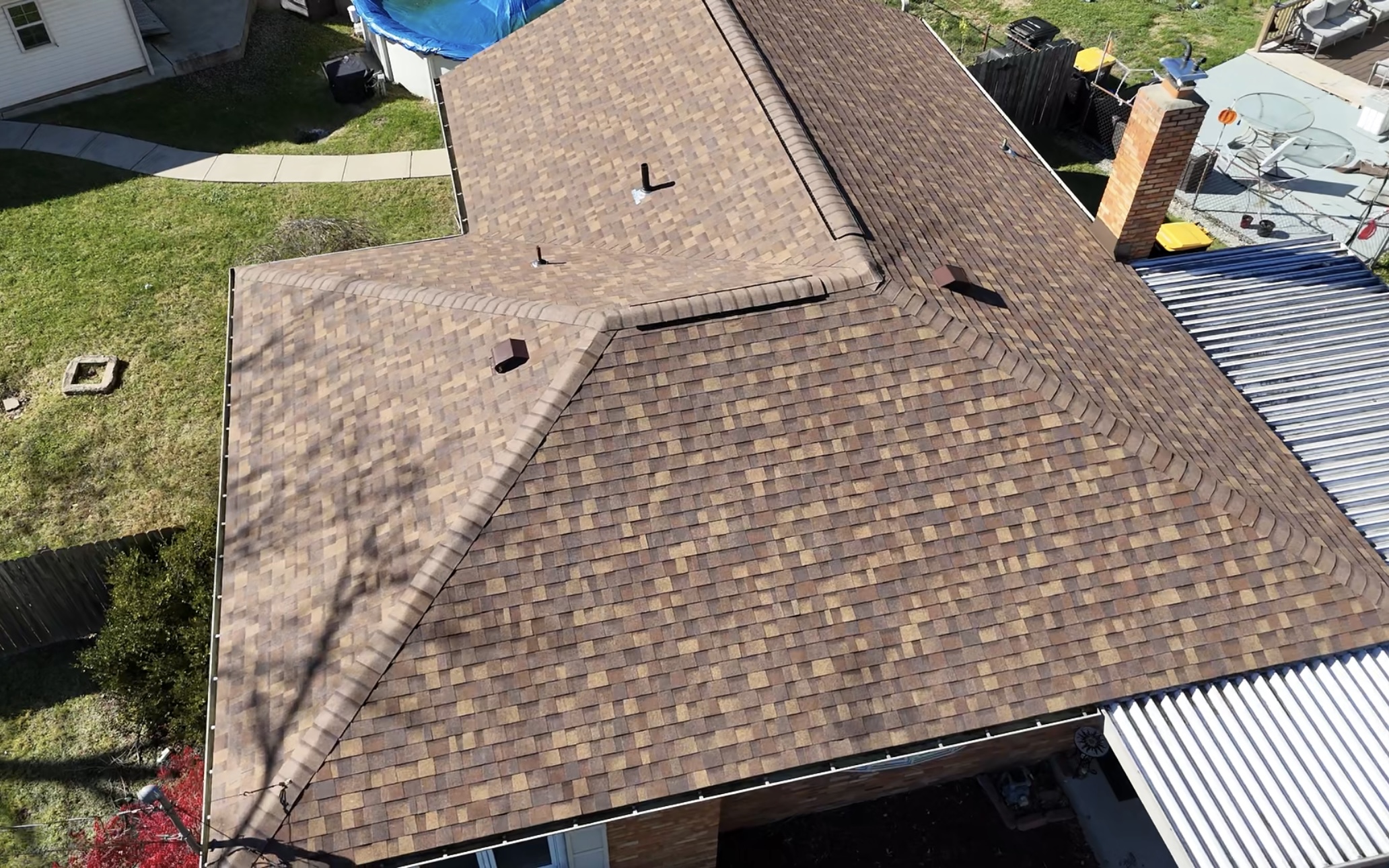 Aerial view of completed re-roof with brown architectural shingles, Pittsburgh PA
