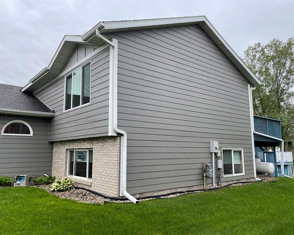 Modern home exterior with fresh vinyl siding installed